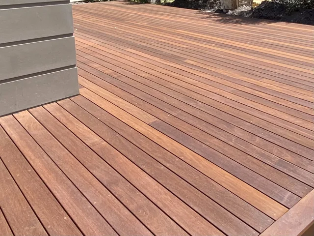 Close view of deck boards meeting a perimeter border